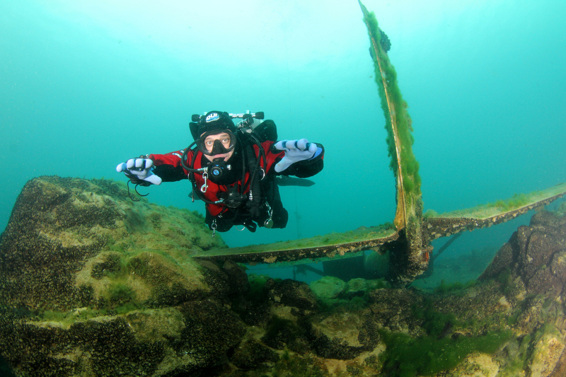 A scuba diver over a wreck of a Cessna airplane at Dutch Springs in Bethlehem Pennsylvania